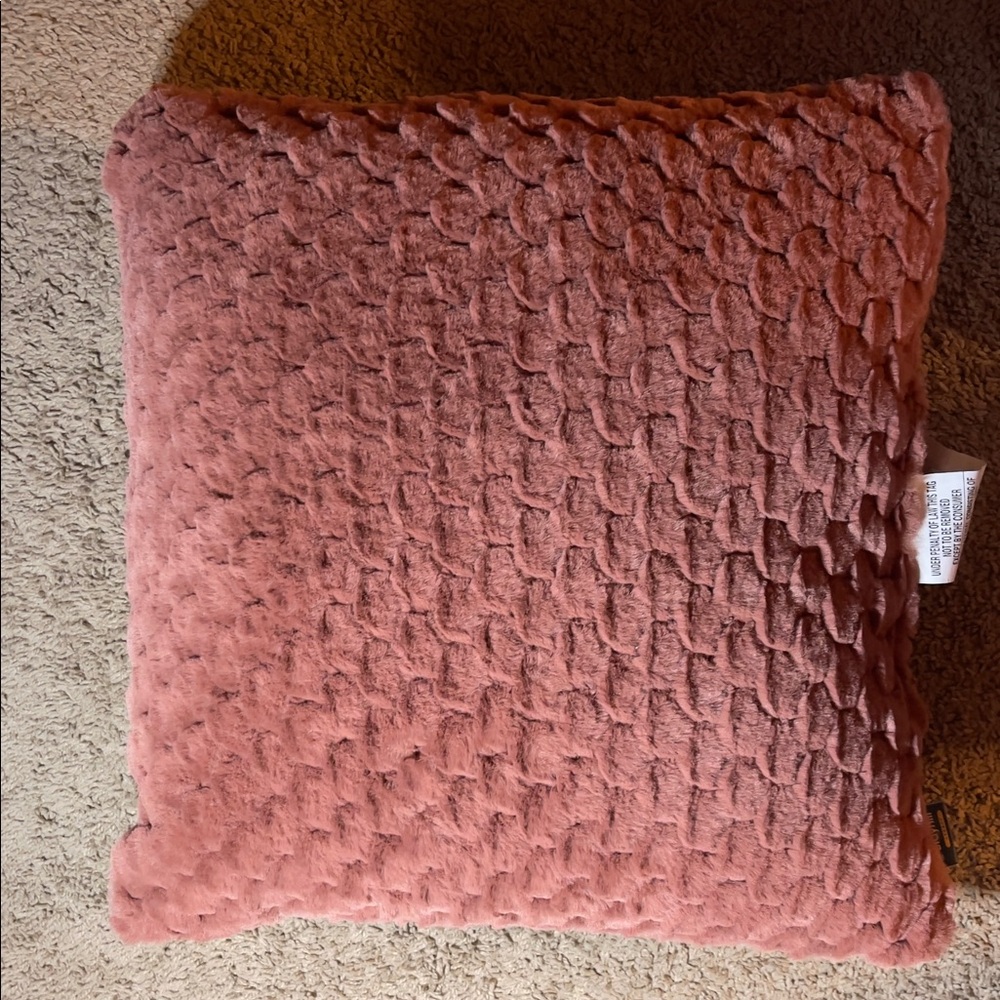 Coral pink, fuzzy decorative pillow